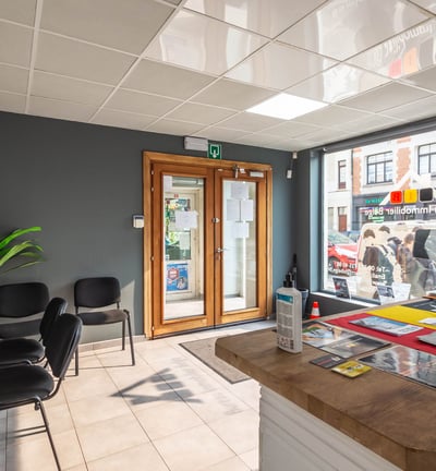 a desk with a computer and a desk with a computer