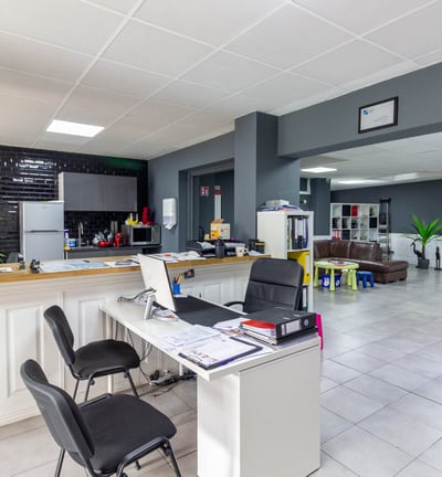 a desk with a laptop and a laptop on it