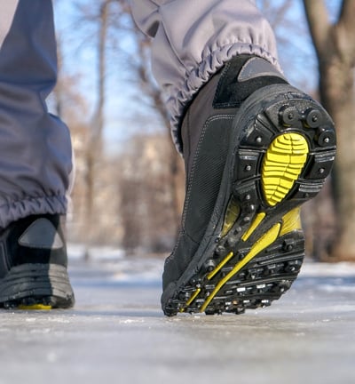 a person walking on a snow covered ground