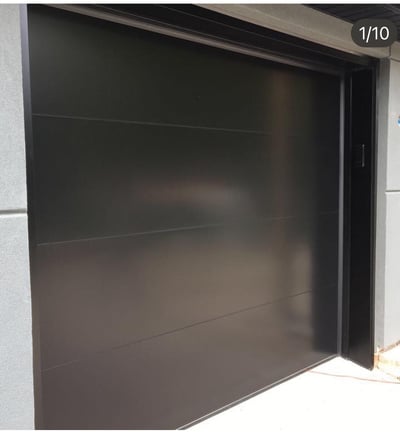 flush black smooth garage door design