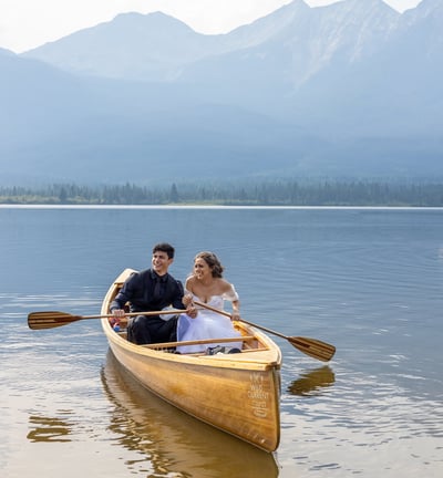 couple canoeing after eloping in jasper