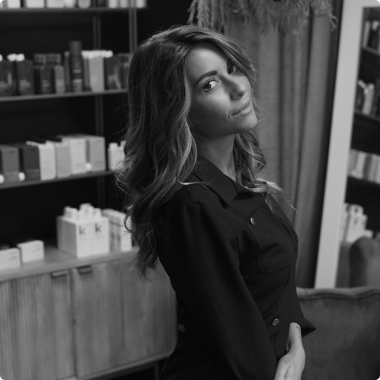 a woman in a black and white photo after a haircut