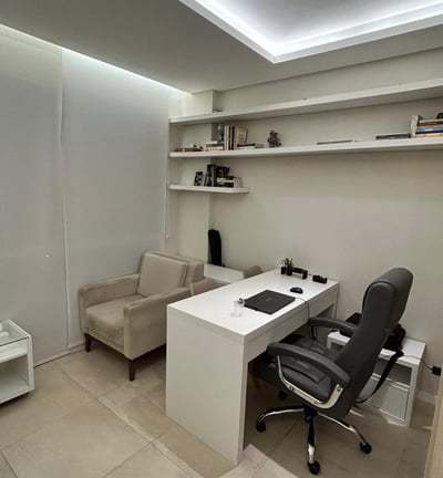 a desk with a chair and a chair in a room