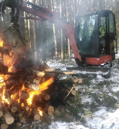 Firesmart debris pile burning using excavator. Kootenay region.