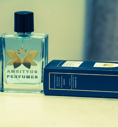 a perfume bottle and a box of perfumes