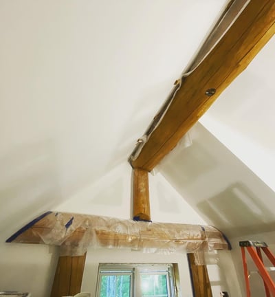 custom log home with freshly sanded drywall and trimtex l-bead