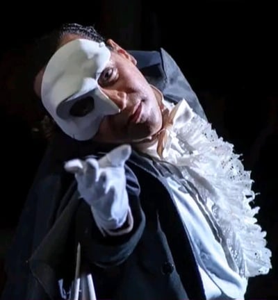 a man in a white mask and a mask on his face