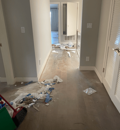 a room with a dirty wood floor