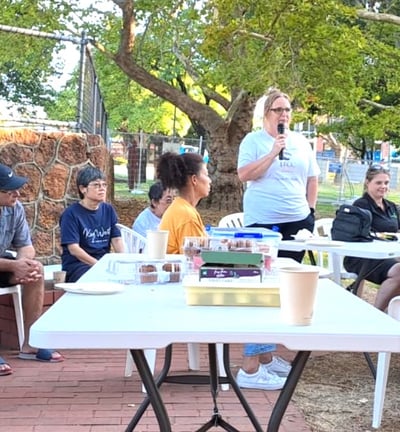 a group of people sitting at a table with drinks