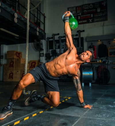 a man doing a kettlebell exercise