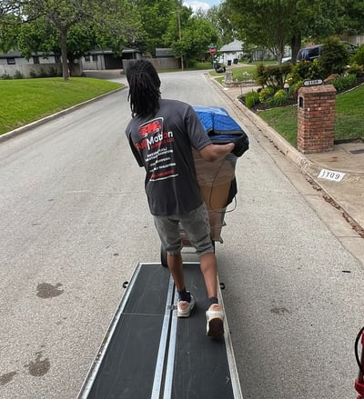 Full Motion Mover is moving down a ramp with a grandfather clock in fort worth, texas