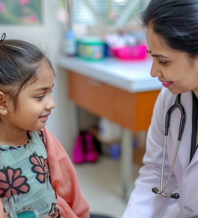A young girl is being examined by a female doctor in a medical setting.