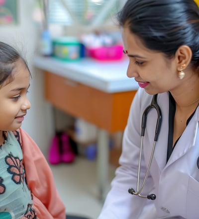 A young girl is being examined by a female doctor in a medical setting.