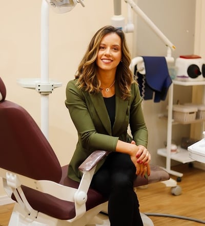 a woman sitting in a chair in a room