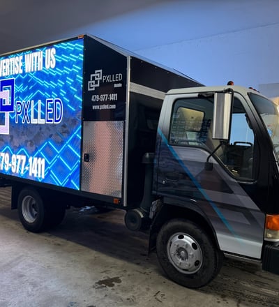 Mobile LED billboard truck promoting PXLLED digital signage and route advertising in Arkansas.