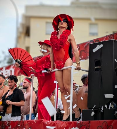 a woman in a red dress and a man in a red dress