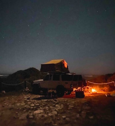 Landcruiser, campsite and night fire near Wedge in Western Australia.