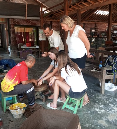 Artisan demonstrating traditional Pottery-making techniques in a Yogyakarta workshop.