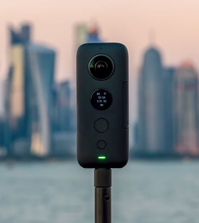 a camera with a city in the background