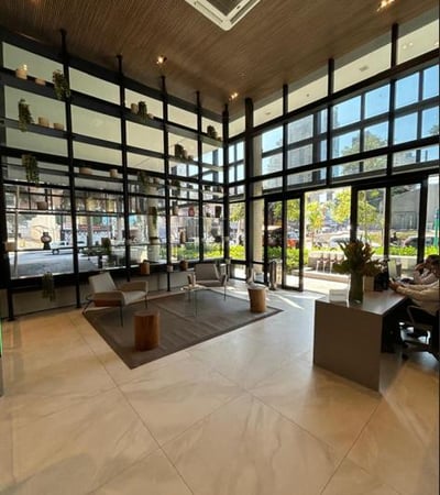 a large open space with a large window and a view of a city