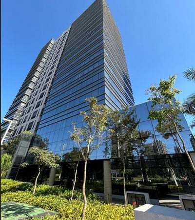 a tall building with a very tall building in the background