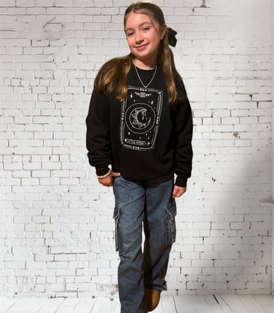 girl in a tarot design black embroidered sweatshirt 