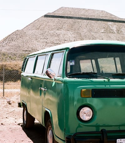 an old green Volkswagon minivan