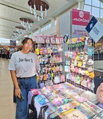 a woman standing in front of a display of toys