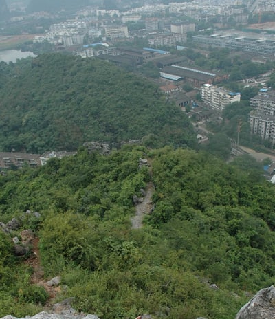 Nick and Tracey Billington climbing the hills above the city of Guilin, China