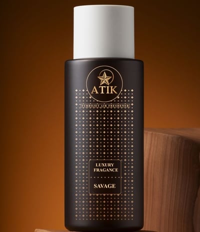 a bottle of an aitk hd air freshener with a logo on it