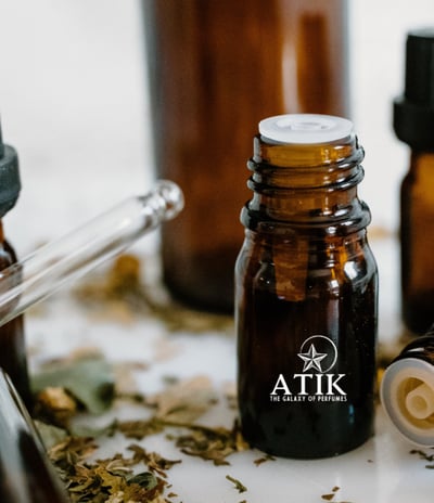 a variety of bottles of atik fragrance oils