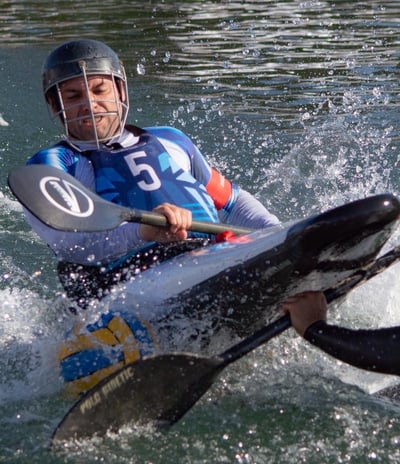 two people are kayaking in the water
