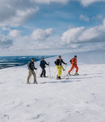 4 persons ski touring in snowy fells, pallas