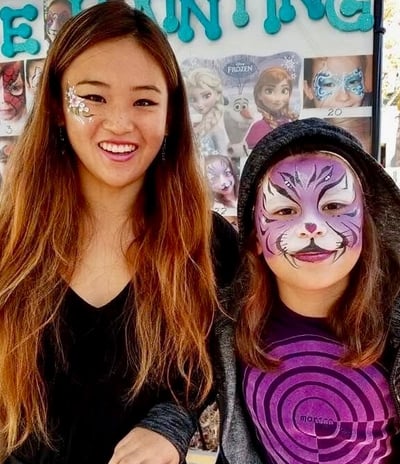 Caroline Face Painting a Purple Tiger at a Birthday Party in Las Vegas