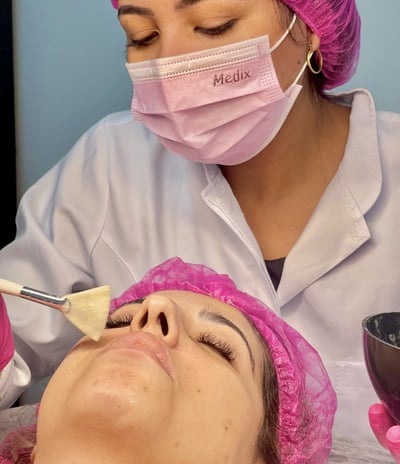 a woman getting a facial lift in a beauty salon