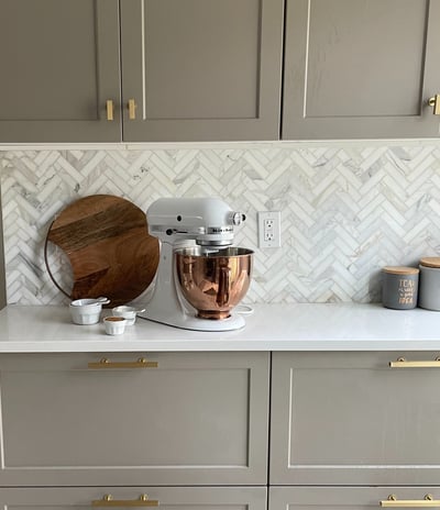 kitchen transformation with herringbone marble backsplash