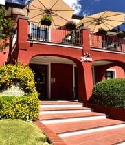 a hotel with a large umbrella and umbrella umbrellas