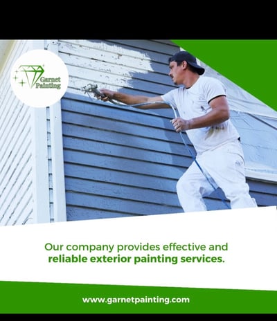 Garnet Painting team working on exterior house painting with company logo visible”