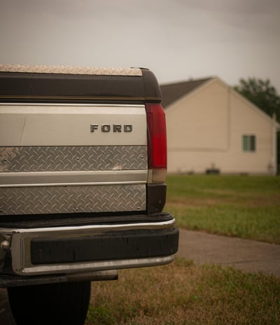 a truck with a truck bed and a truck parked in front of it