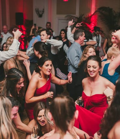 a group of people dancing at a party