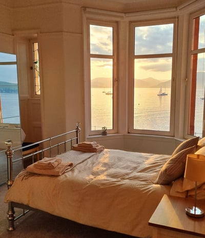 A kingsize master bed room at Gourock Seaview Holidat Let with views across the sea
