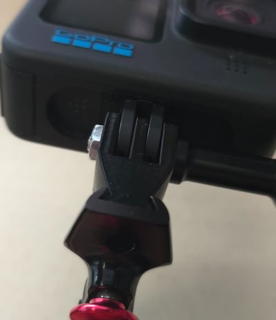 Uni-Mount black "Single" mount, mounted on exposure clamp with Gopro camera