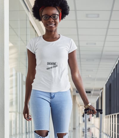 a woman in ripped jeans and a white t - shirt