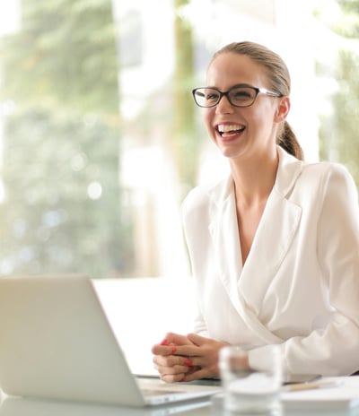 a woman in a robe is smiling and laughing