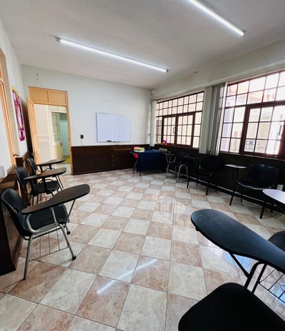 a room with chairs and tables and chairs