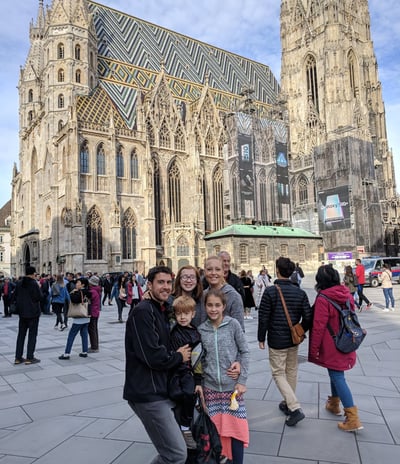 family in front of notre dame cathedral