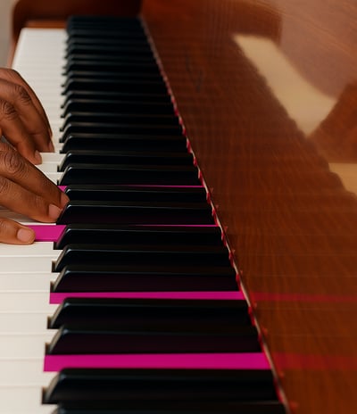 fingers of an african musician on the piano keys