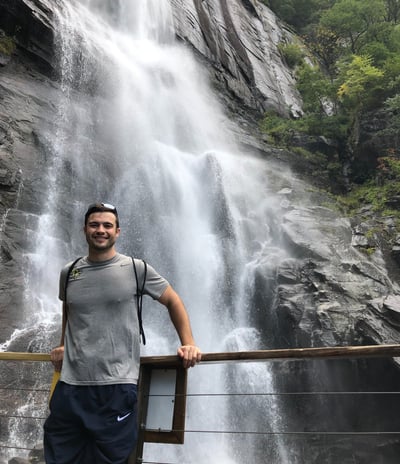 Travel physical therapist enjoying a waterfall on a weekend
