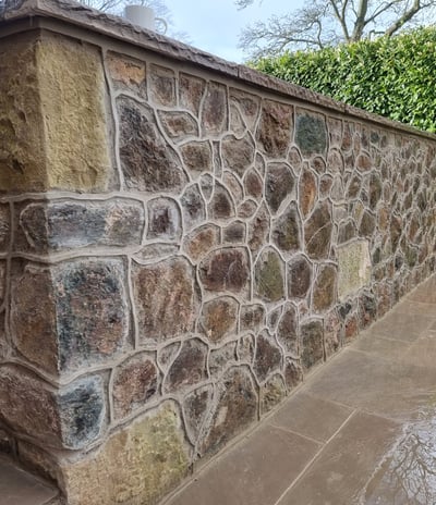 Malvern stone wall with raised pointing