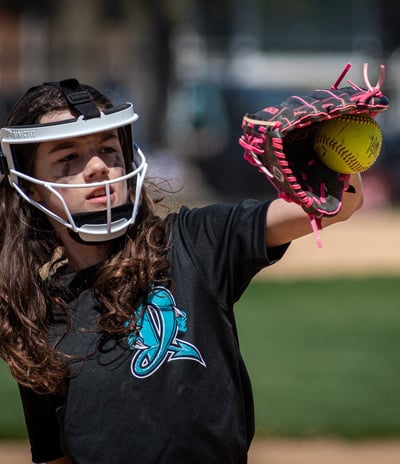 Photo of softball plater catching ball